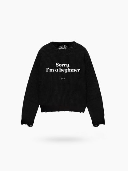 WORDLESS APRÉS-SKI I’M SORRY DISTRESSED SWEATER